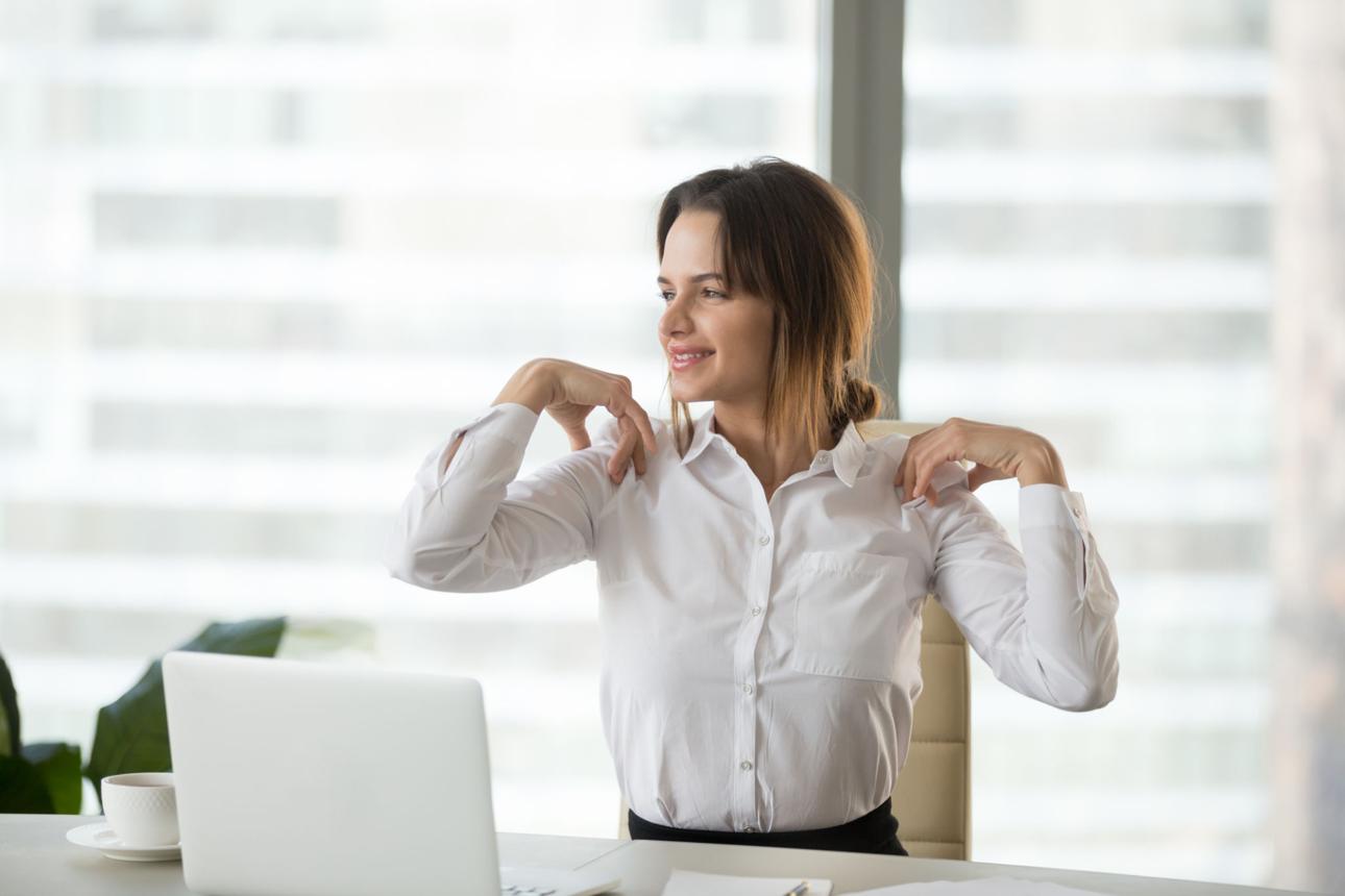 Office worker stretching neck and shoulders